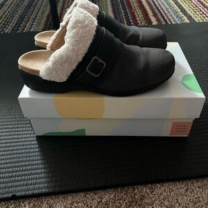 Earth Black and White Shearling Clogs